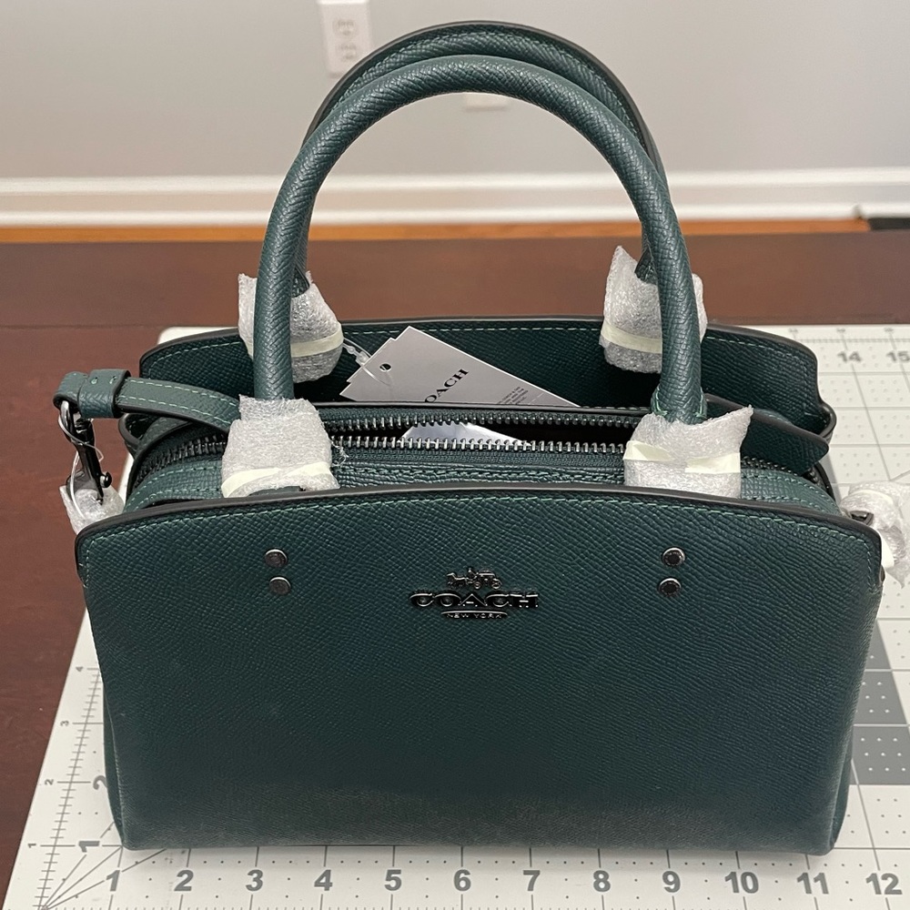 Brand new Coach Mini Lillie in dark forest green.